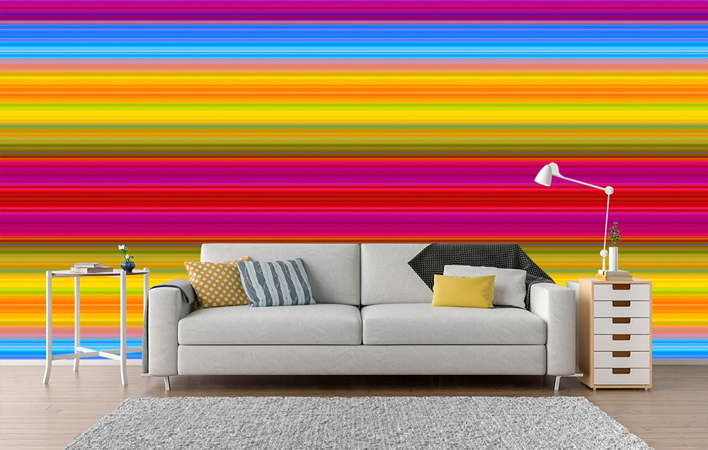 Wall mural - Bright living room with grey sofa and colourful stripe pattern wall in the background