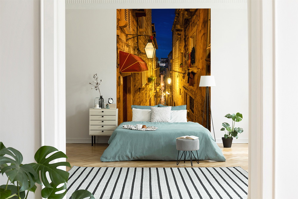 Wall mural - bedroom with mural of an illuminated alleyway at night, creating a warm and inviting atmosphere
