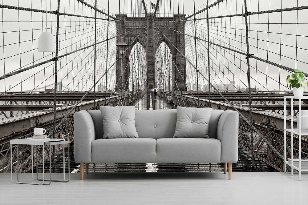 Wall mural - living room with focus on photorealistic depiction of the Brooklyn Bridge in monochrome colours