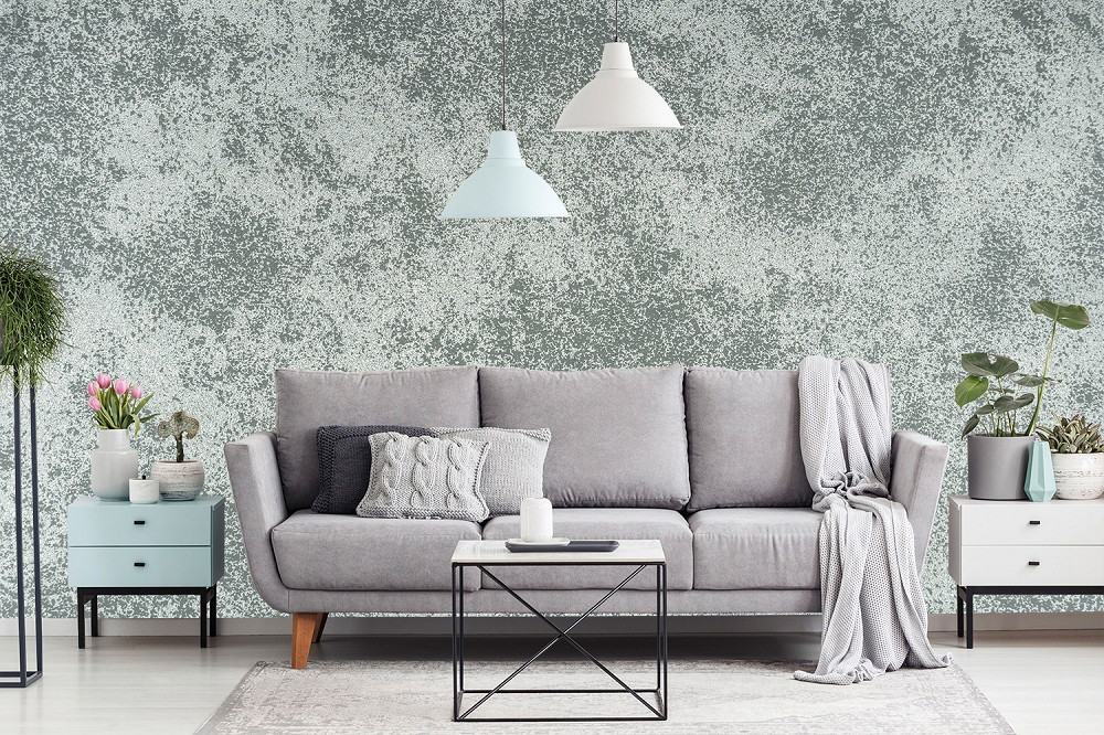 Wall mural - Grey sofa with cushions, plants and hanging lamps in a stylishly decorated living room