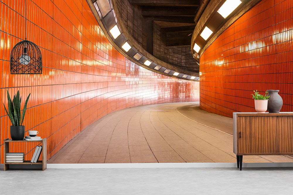 Fototapete - Leuchtend orangefarbener Tunnel mit stilvollem Ambiente in einem modernen Raum
