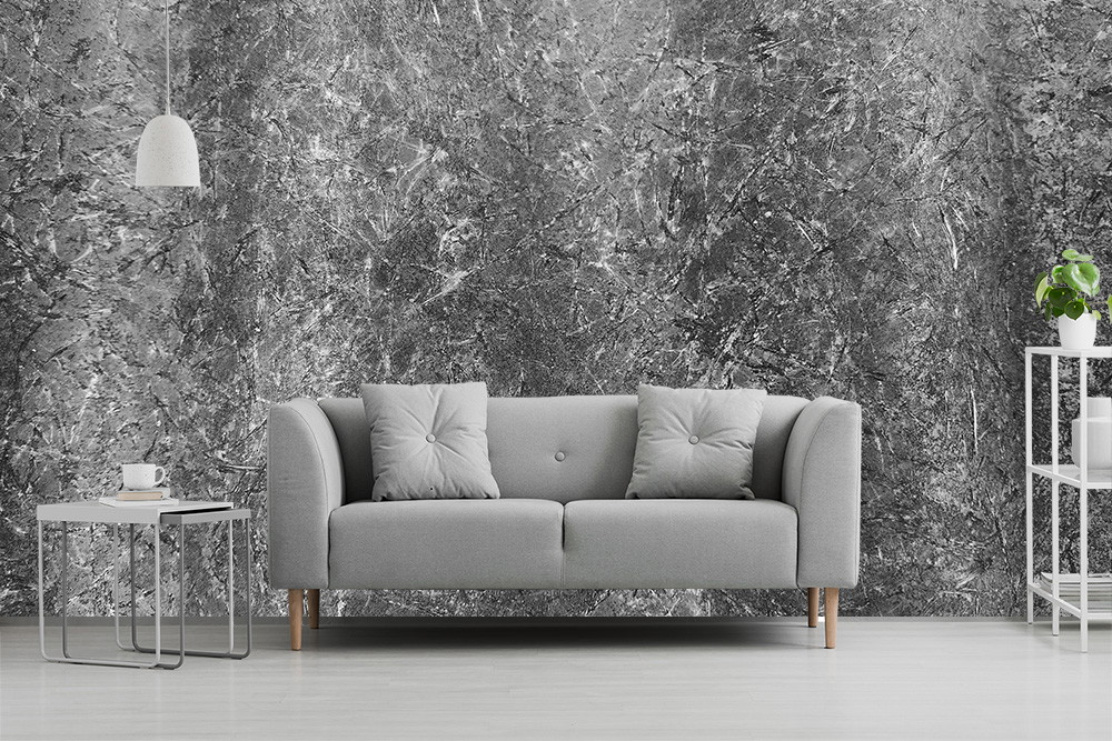 Fototapete - Modernes Wohnzimmer mit grauer abstrakter Texturtapete, grauem Sofa und minimalistischem Dekor