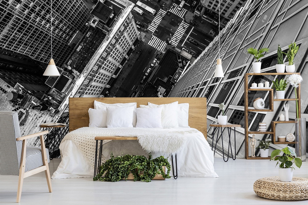Wall mural - Stylish bedroom with wall mural of a city skyline in black and white
