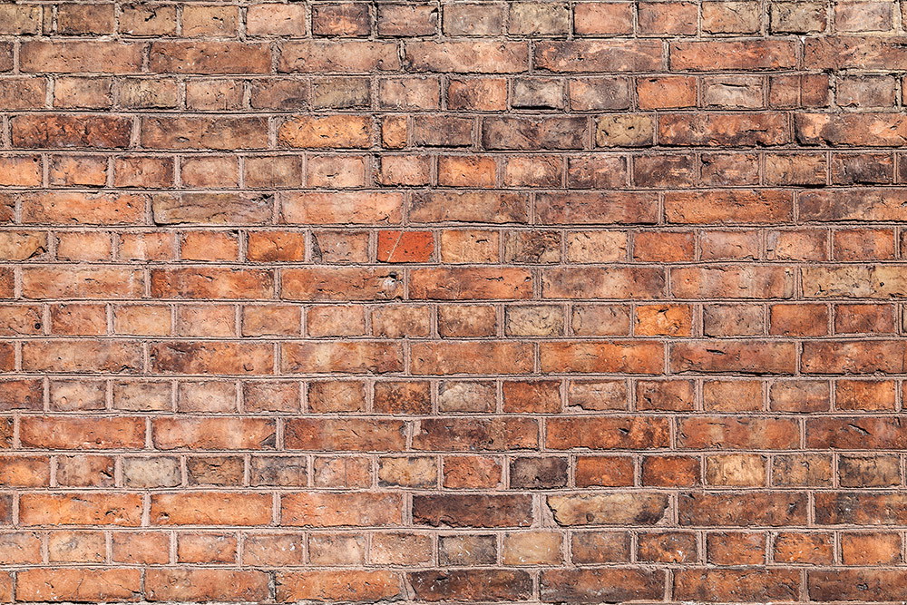 Wall mural - View of a rustic brick wall, ideal for urban interior design