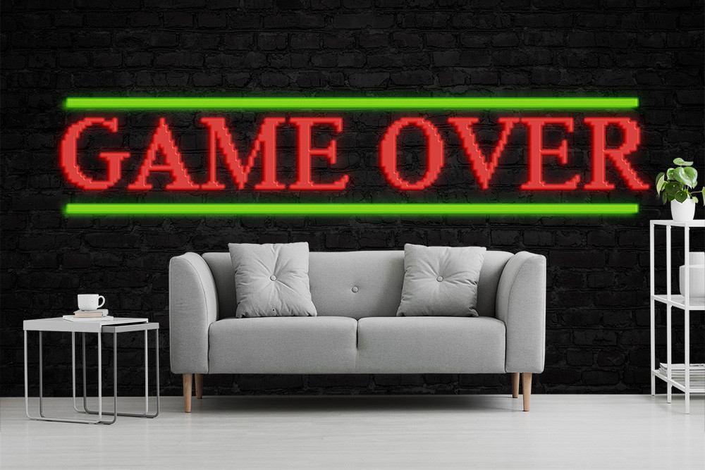 Papier peint photo - Salon moderne avec canapé gris, table d'appoint et inscription en néon 'GAME OVER' sur un mur de briques noires