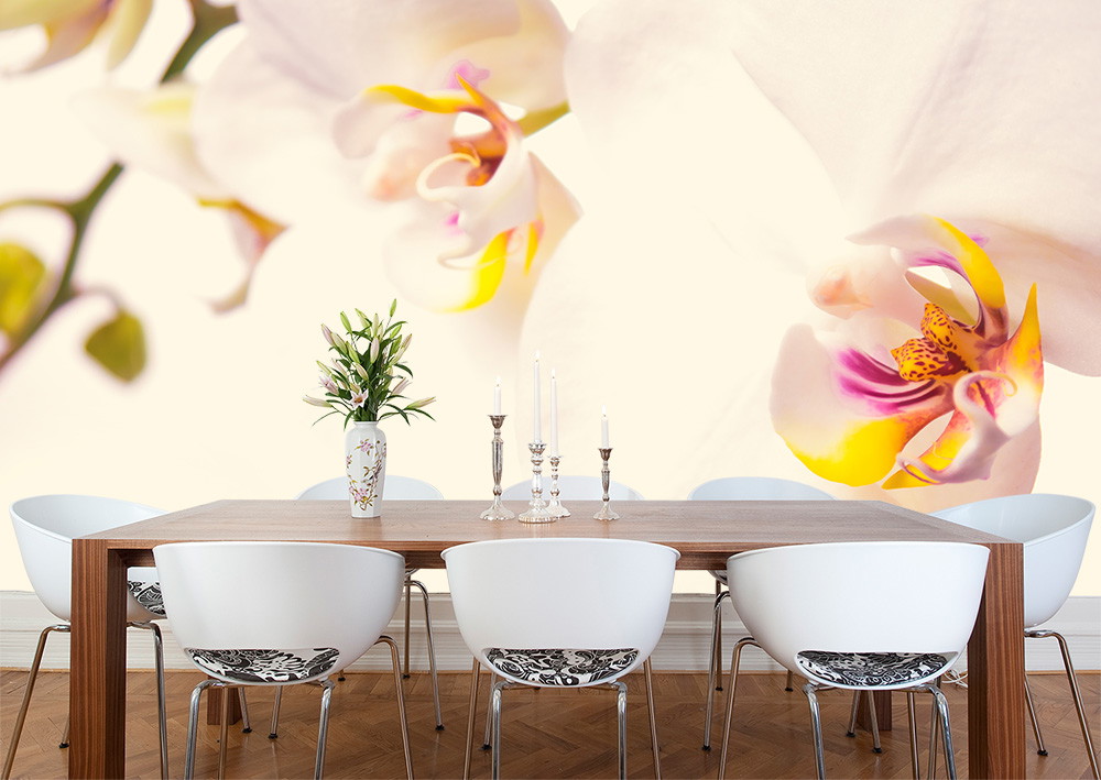 Wall mural - Dining room with large-scale wall decoration of orchid blossoms and stylish table arrangement