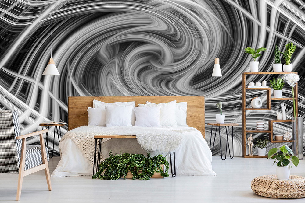 Fototapete - Ein Schlafzimmer mit einer beeindruckenden Schwarz-Weiß-Wirbel-Design-Wand, dekoriert mit modernen Holzmöbeln und Pflanzen.