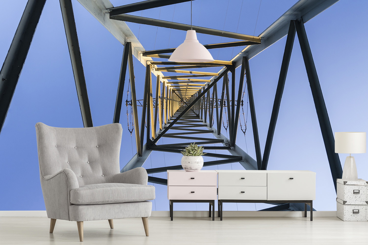 Fototapete - Industrielles Design mit Stahlträgern unter blauem Himmel hinter einem grauen Sessel und einem modernen Sideboard im Wohnzimmer.