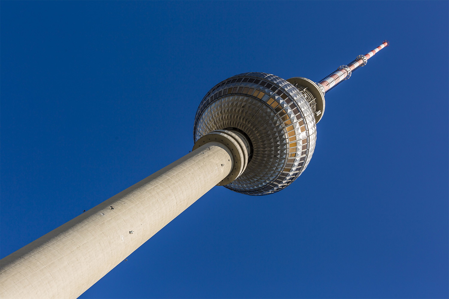 Wall mural - Close-up of the television tower against a clear blue sky