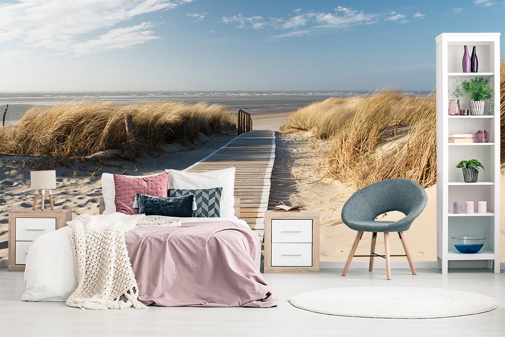 Wall mural - Bedroom with calming beach landscape, grassy dunes and jetty in the distance