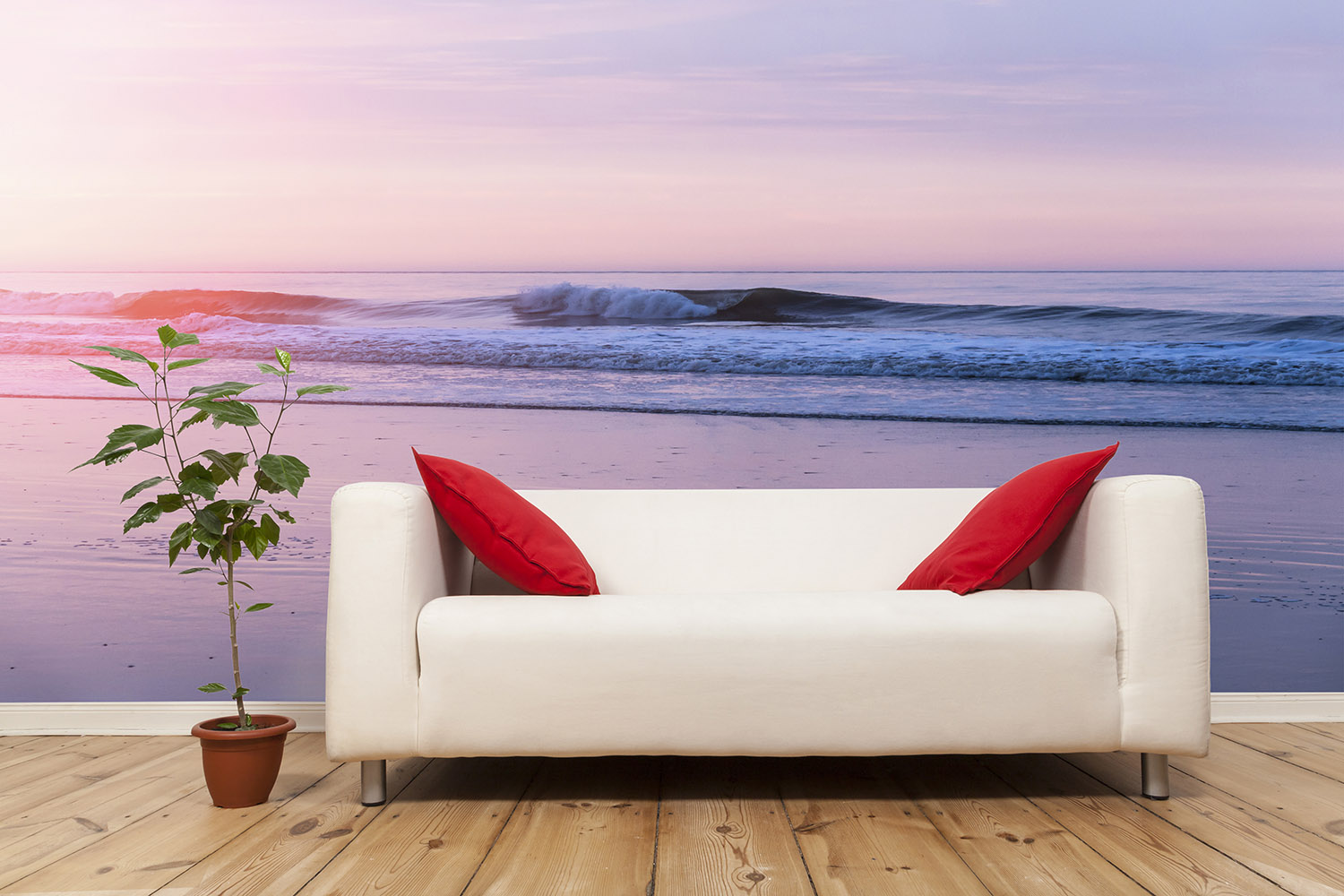 Wall mural - Cosy living room with beach motif in the background, sofa with red cushions and potted plant