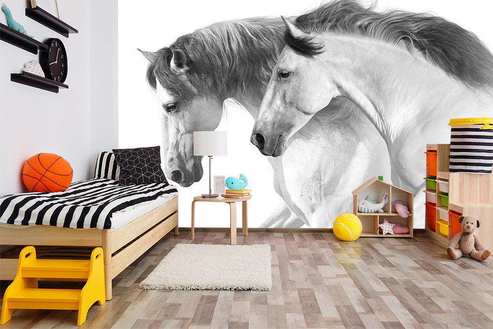 Wall mural - children's room with stylish black and white horse motifs on the wall, wooden floor and colourful toy boxes