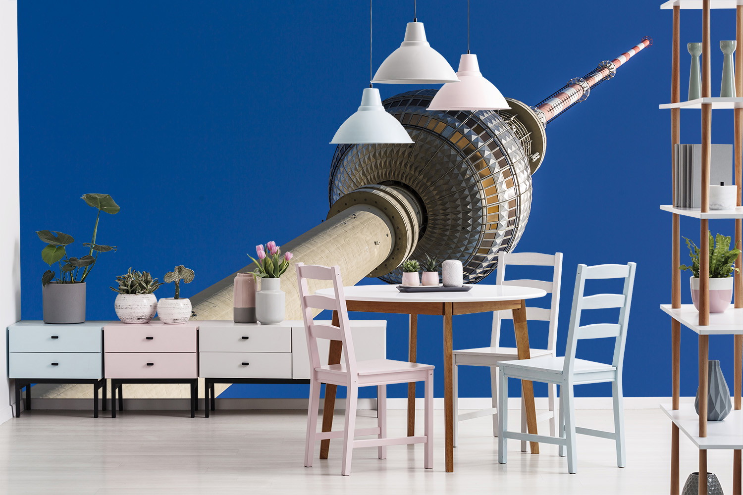 Wall mural - Close-up of a tower with modern ambience and white dining table