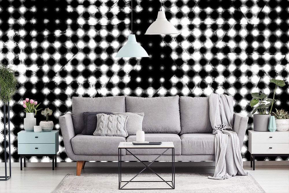 Fototapeta - Salon z szarą sofą, czarno-białą tapetą w kropki i minimalistycznymi meblami