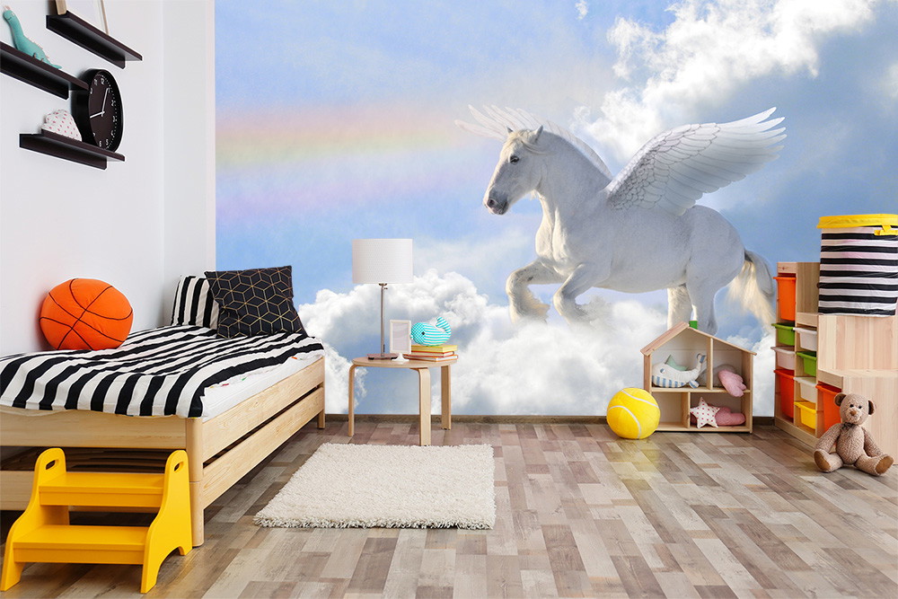 Fotomurale - Camera per bambini con un Pegaso volante sopra le nuvole e un arcobaleno sullo sfondo