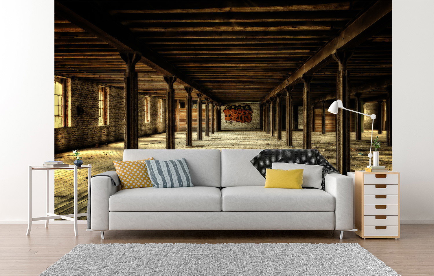 Fototapete - Wohnzimmer mit weißem Sofa vor Tapete mit Bild eines weiträumigen, verlassenen Industriegebäudes aus Holz mit Graffiti an der Wand