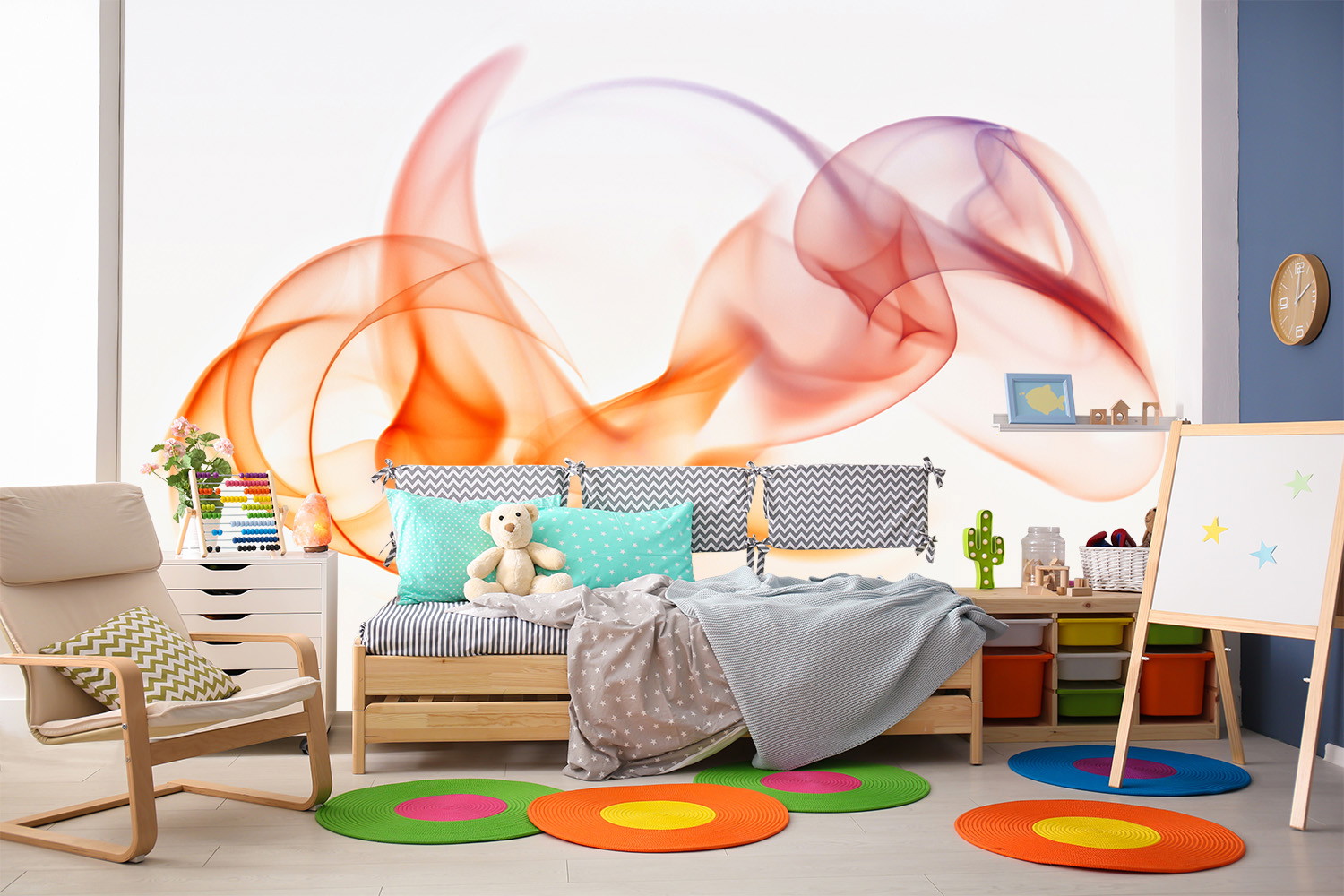 Wall mural - children's room with colourful wall design, bed with pillows, toys and colourful carpets