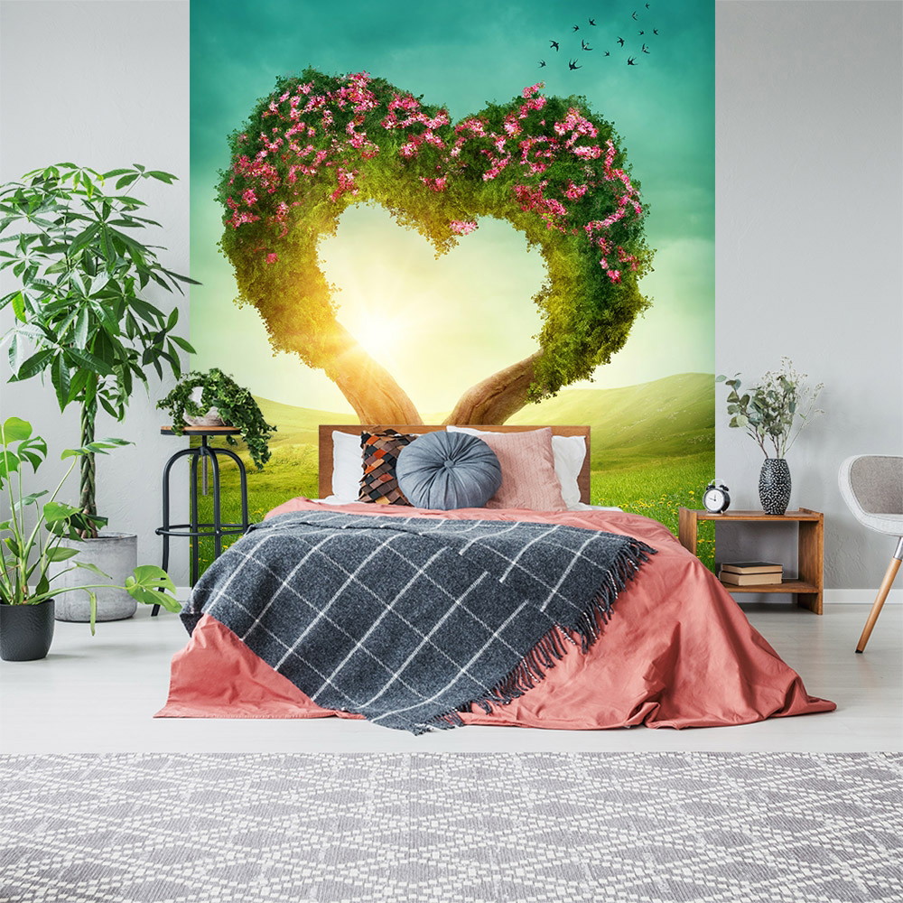Fototapete - Romantische Schlafzimmerdeko mit Herz aus Baum und Blumen im Sonnenuntergang