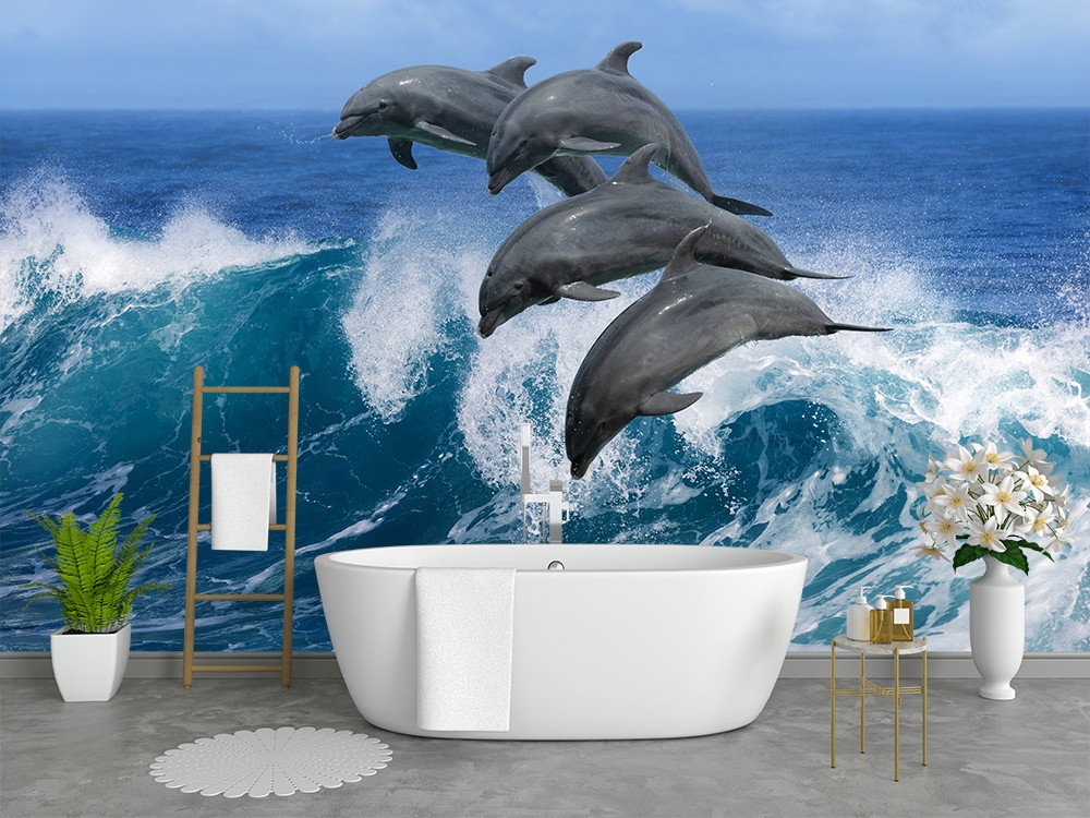 Wall mural - bathroom with freestanding bathtub surrounded by a wallpaper of dolphins jumping over a large wave