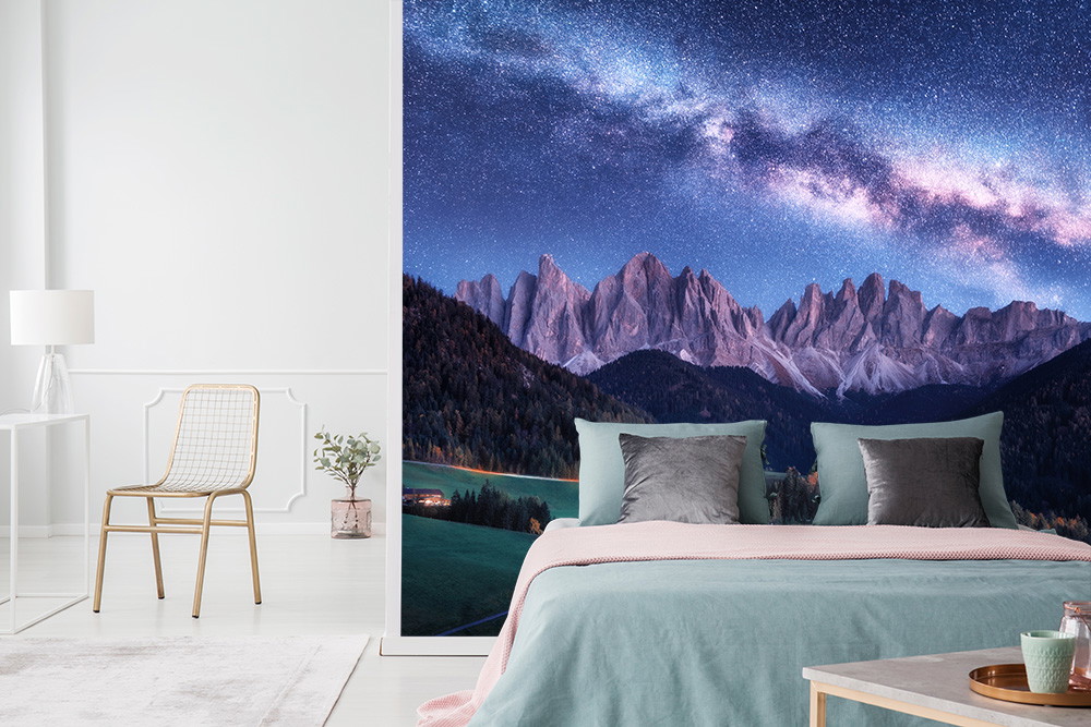 Wall mural - Bedroom with impressive mountain landscape and starry sky at night