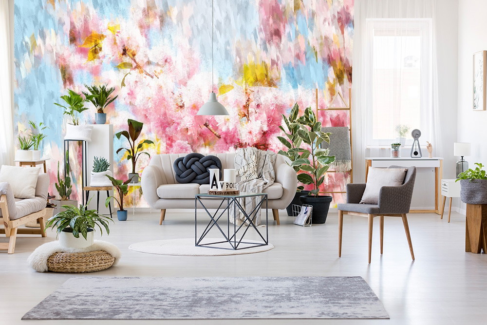 Wall mural - Bright living room with abstract, colourful wallpaper, stylish furniture and green plants