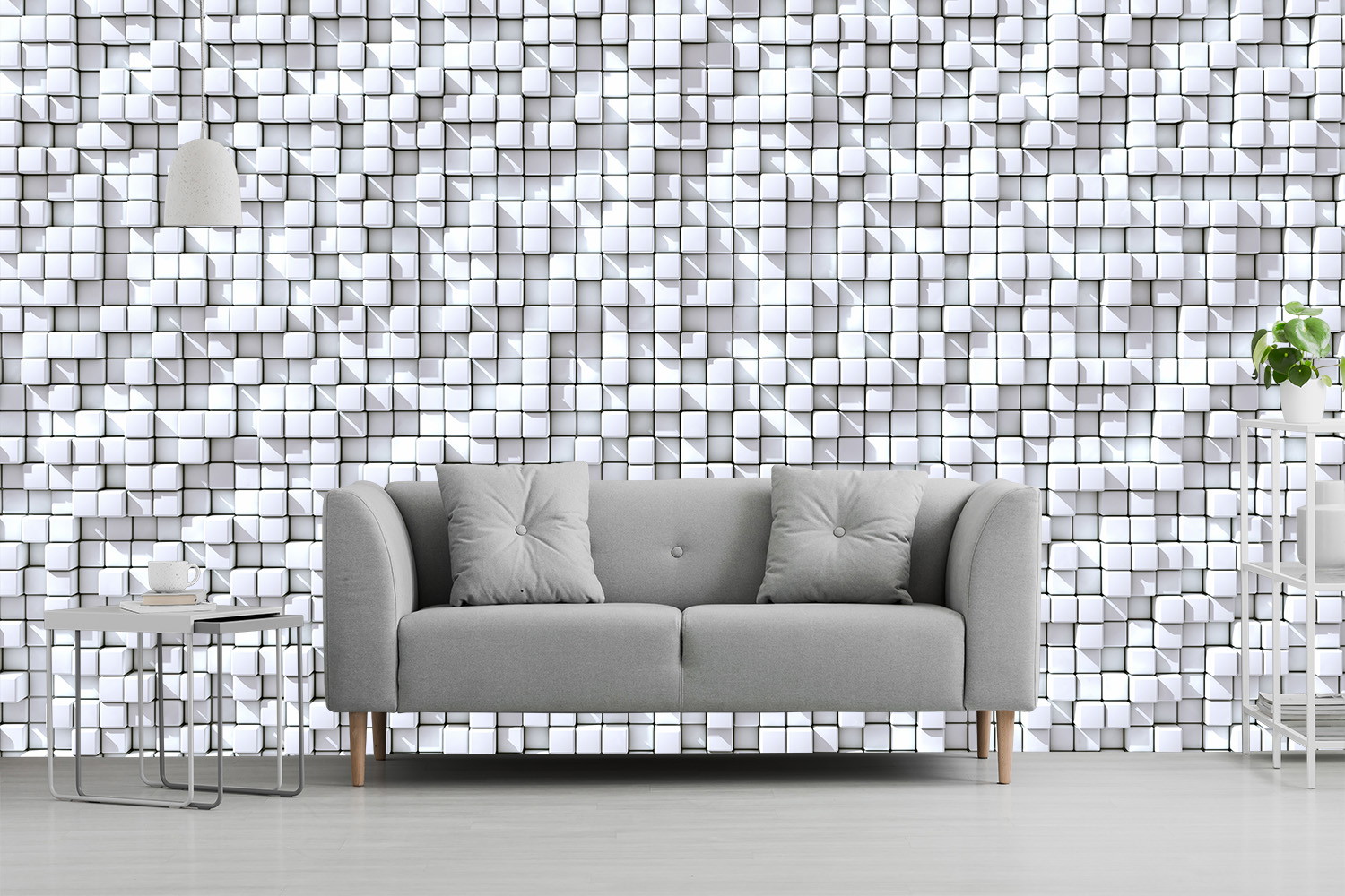 Fototapete - Graues Sofa vor einer Wand mit 3D-Würfelmuster in Weiß und Grau, dekoriert mit Tisch und Pflanze