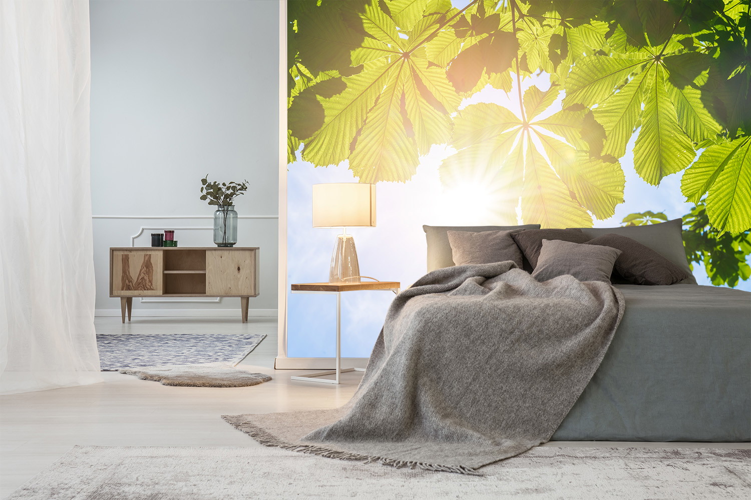 Wall mural - Bedroom with calming leaf décor wallpaper, cosy bed and modern furnishing mix