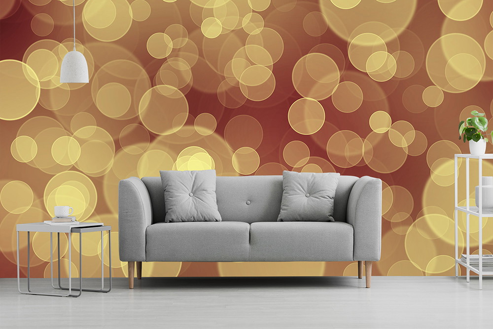 Wall mural - Living room with grey sofa and table in front of a wall mural with abstract bokeh effect in warm gold and brown tones