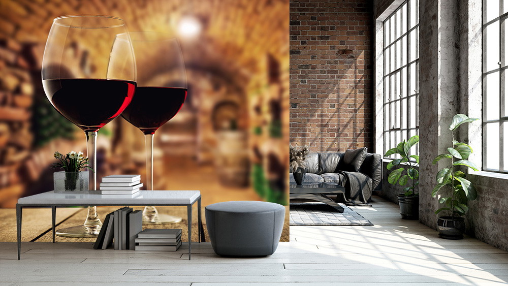Wall mural - living room with brick wall, large windows and a wallpaper with two wine glasses against a blurred cellar background