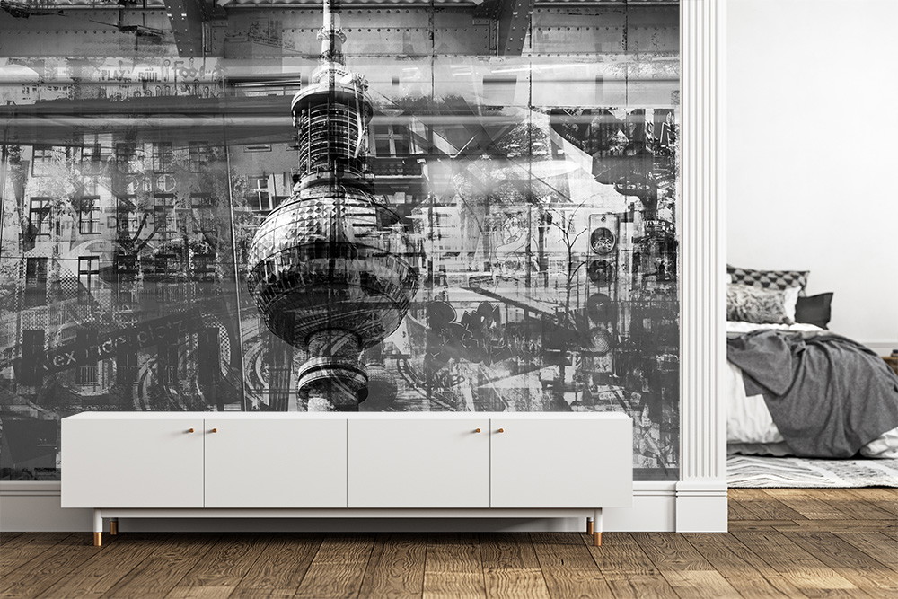 Muurschildering - Stijlvolle, stedelijke collage in zwart en wit met een opvallende toren, ideaal voor een eigentijdse inrichting van de woonkamer