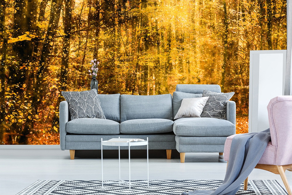 Wall mural - Modern living room with grey sofa in front of an autumnal coloured forest motif