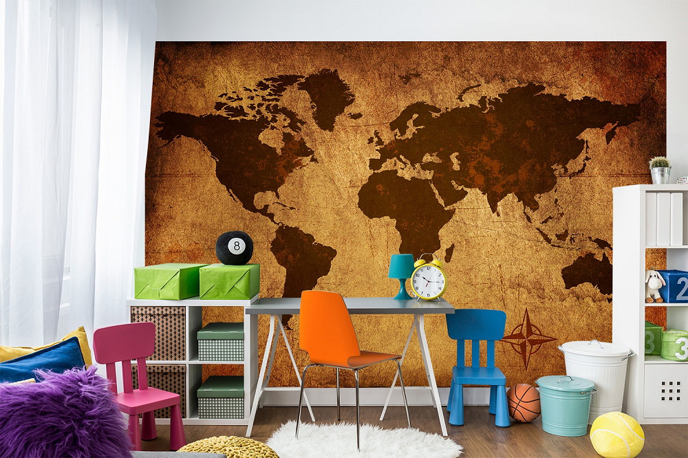 Wall mural - vintage world map in warm brown tones on the wall of a children's room with colourful furniture