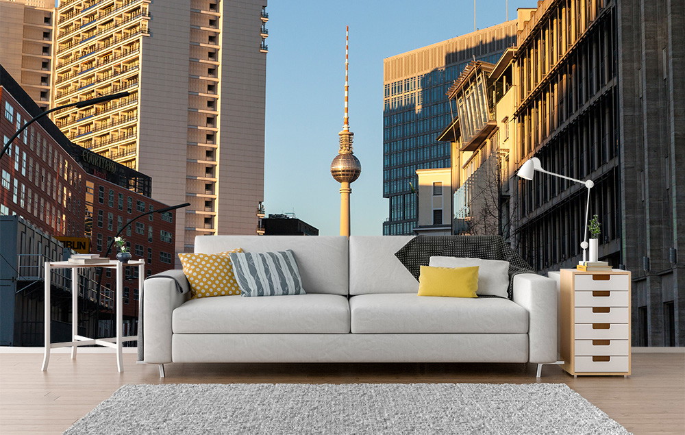 Wall mural - Stylish living room with sofa and Berlin skyline in the background