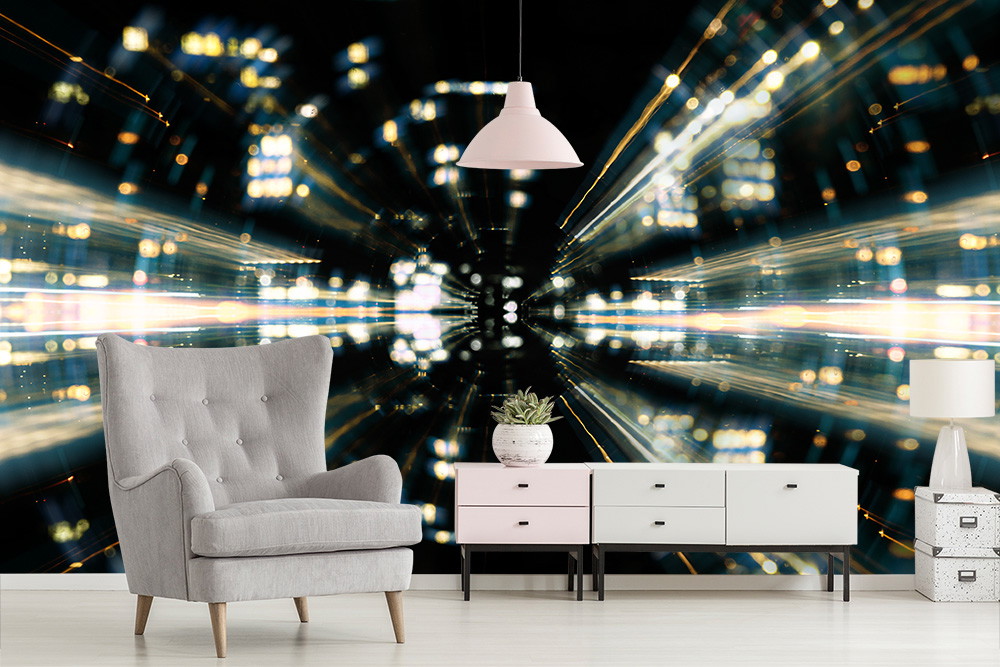 Wall mural - Futuristic lights in urban design behind a cosy living room with grey armchair and sideboard