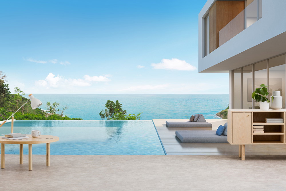Fotomurale - Interni luminosi e moderni di una villa con piscina a sfioro e viste pittoresche sul mare sotto un cielo terso