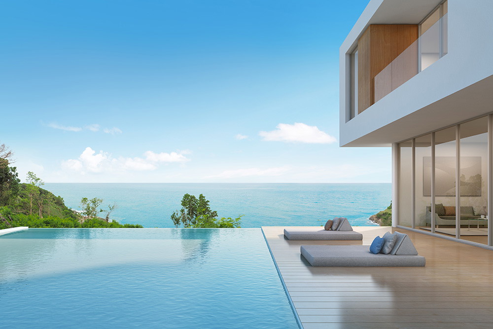 Fototapete - Luxuriöse Villa mit Infinity-Pool und Blick auf das Meer bei sonnigem Wetter