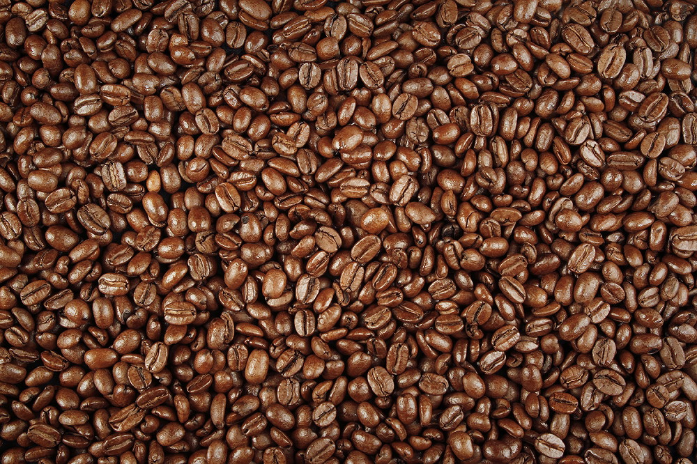 Muurschildering - close-up van gebrande koffiebonen, voor een warme en uitnodigende sfeer