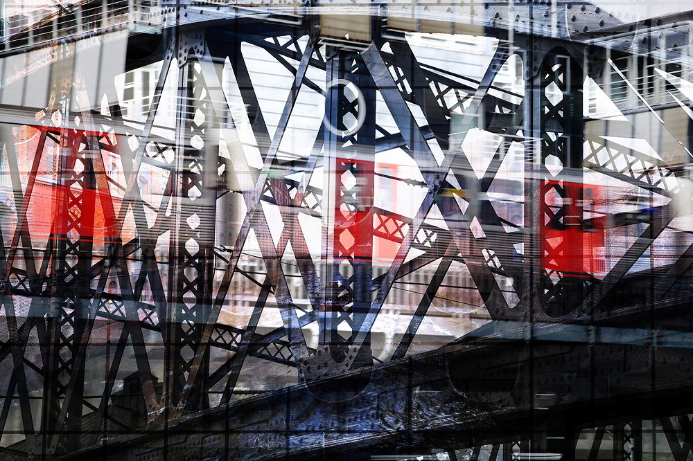 Wall mural - Detailed steel bridge construction with passing train in urban surroundings