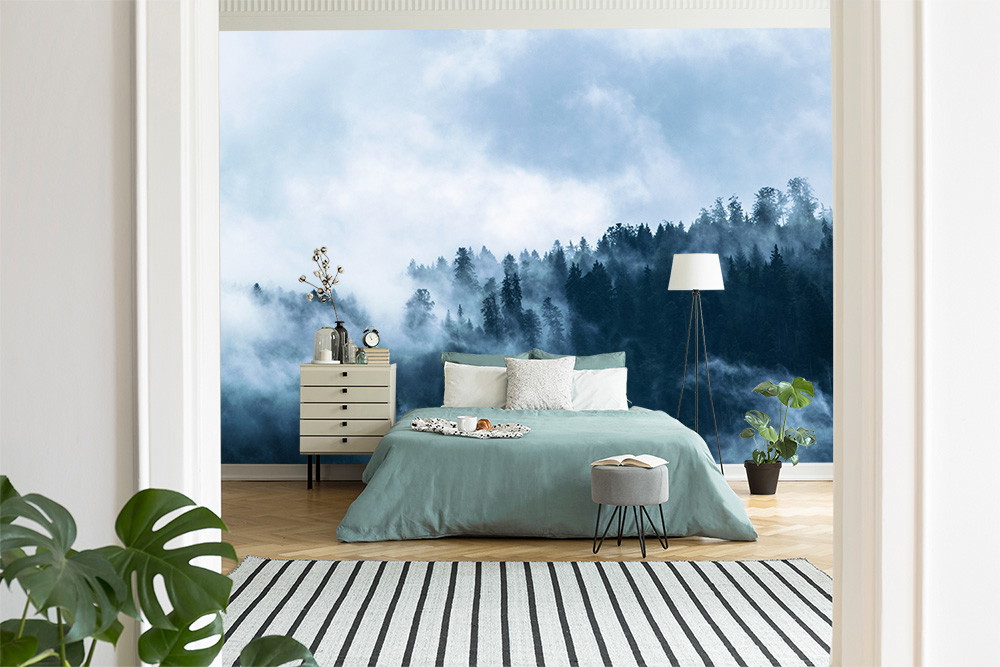 Wall mural - bedroom with image of a misty forest scene that creates a calming atmosphere