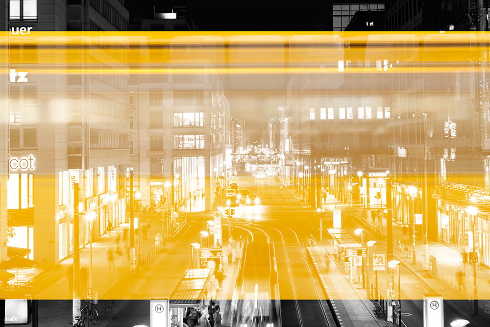 Wall mural - Black and white urban night scene with yellow light stripes representing movement and dynamics