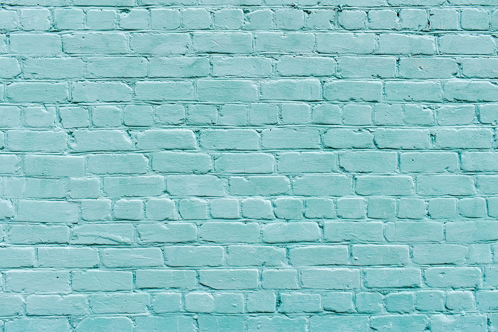 Wall mural - Light blue brick wall as a decorative element