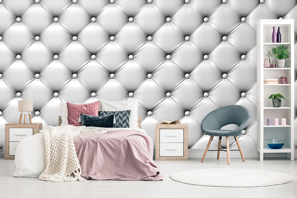 Wall mural - Bedroom with stylish quilted wallpaper, bed with pillow and blanket, and modern furniture