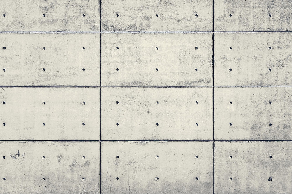 Muurschildering - Moderne betonnen muur met vierkante panelen en zichtbare boorgaten