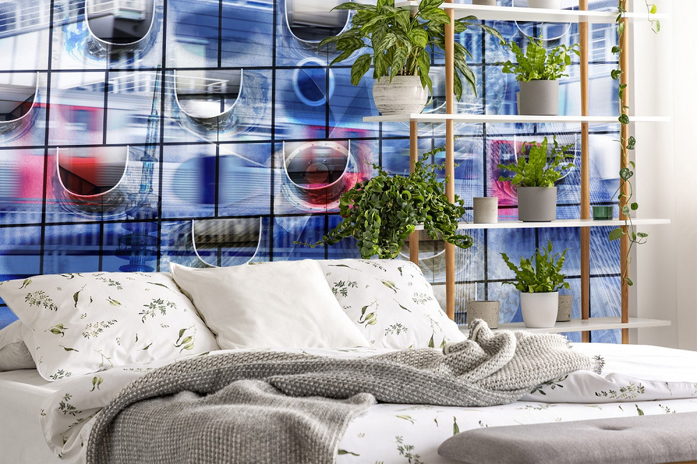 Wall mural - Bedroom with a creative blue wall mural and plants on a shelf, creating a modern and inviting design