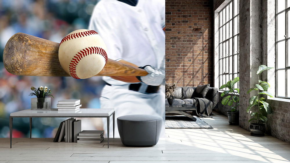 Wall mural - Close-up of a baseball player with bat and ball in a modern, light-flooded loft