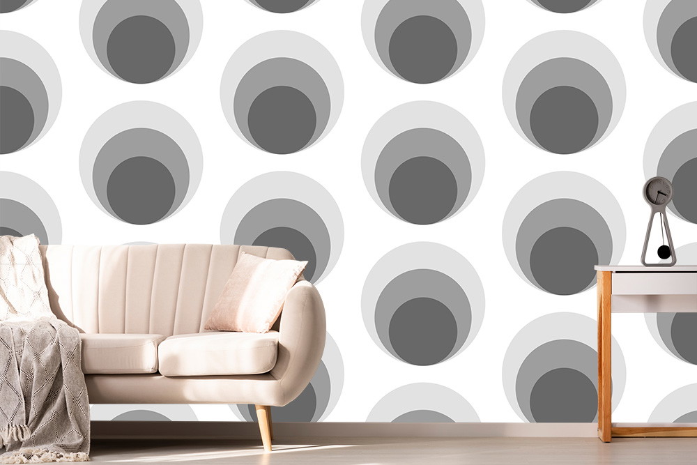 Fototapete - Graue Kreismuster auf weißem Hintergrund hinter einem beige Sofa und einem kleinen Tisch